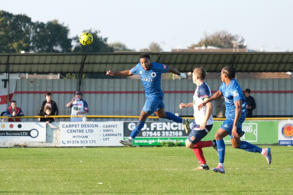johnville renne wins a header against witham town
